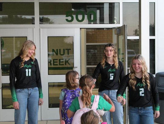 Volleyball players spread Hornet spirit